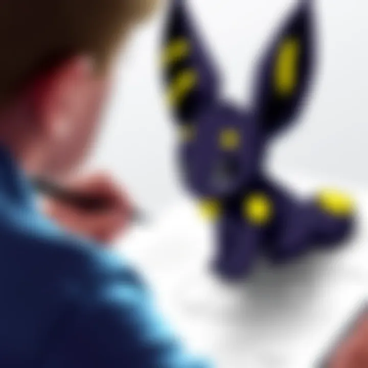 An artist drawing Umbreon, a black Pokémon with yellow rings, on a sketchpad