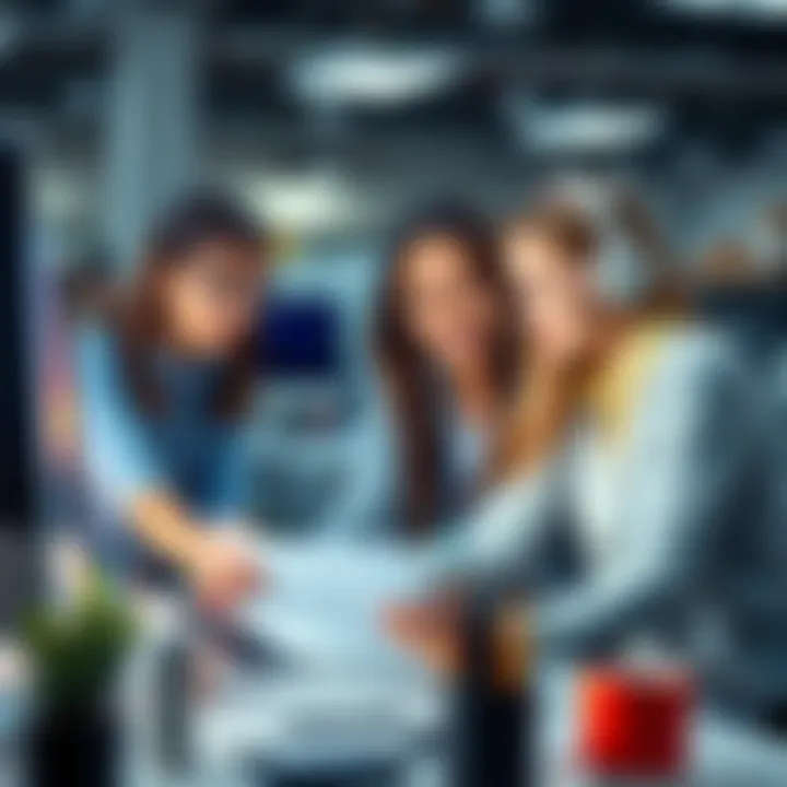 Young interns collaborating on a project in a printing and advertising office, analyzing data on computers and discussing strategies for inventory and forecasting