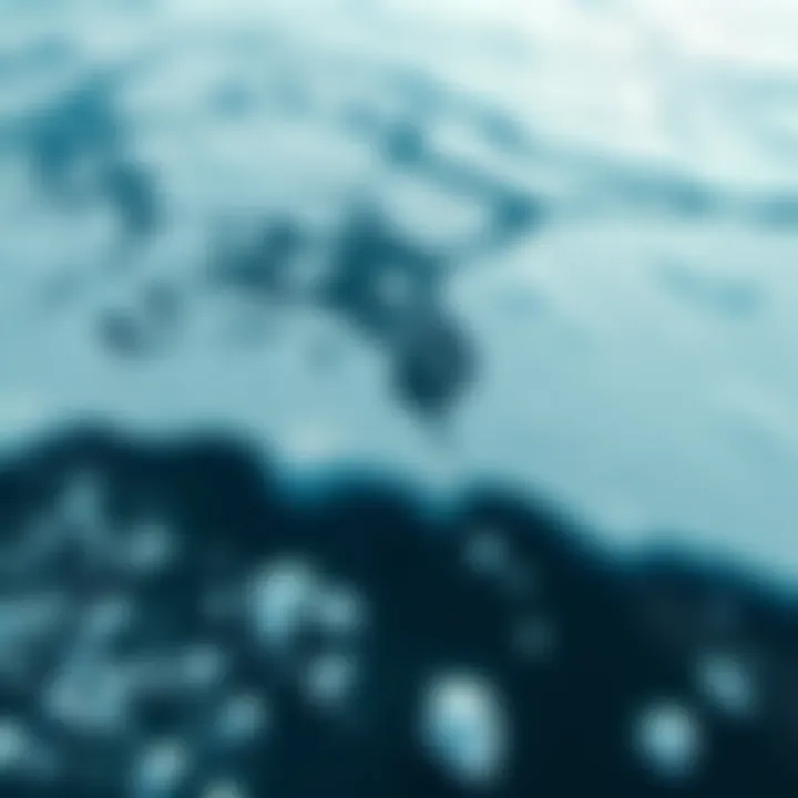 Aerial view of large ice sheets melting into the ocean, with visible water pooling and ice fragments breaking off.