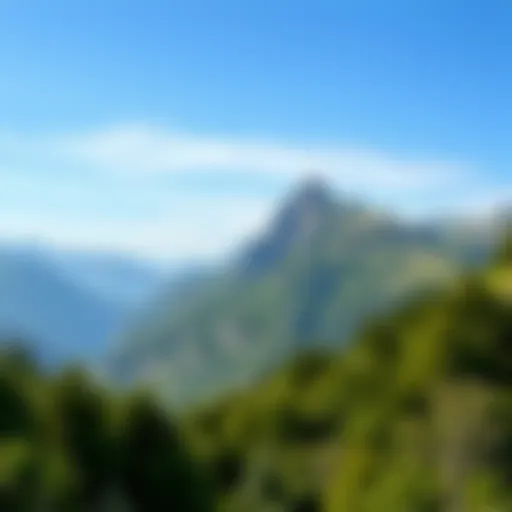 A scenic view of a mountain range with lush greenery and a clear blue sky