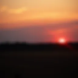 A sunset over a quiet field, evoking feelings of nostalgia for the past