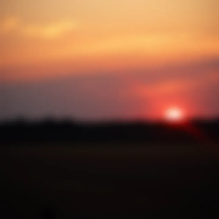 A sunset over a quiet field, evoking feelings of nostalgia for the past