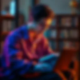 Individual engaged in reading a book while simultaneously using a laptop for information gathering