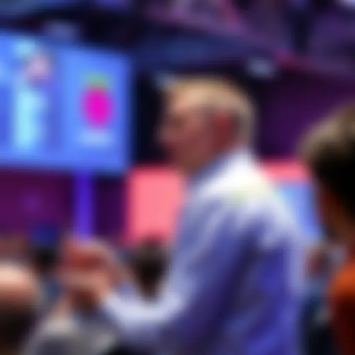 Leader of Raspberry Pi speaks at a conference, emphasizing concerns over AI's effect on tech jobs, with an audience in the background listening attentively.