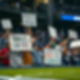 Tampa Bay Rays fans holding signs expressing their frustration with FOX Sports coverage at a baseball game.