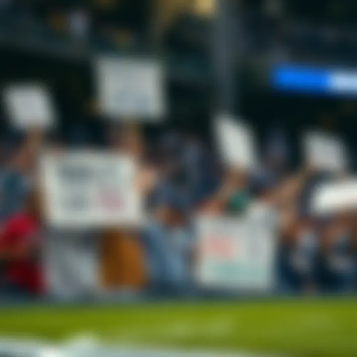 Tampa Bay Rays fans holding signs expressing their frustration with FOX Sports coverage at a baseball game.