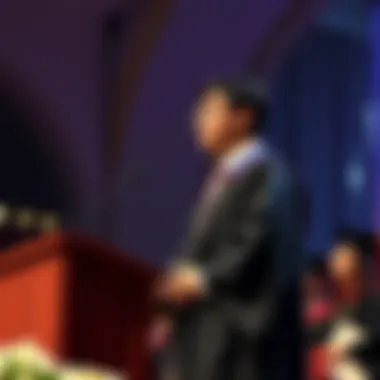 Ronny Chieng stands on stage at Harvard graduation ceremony, addressing graduates about AI.