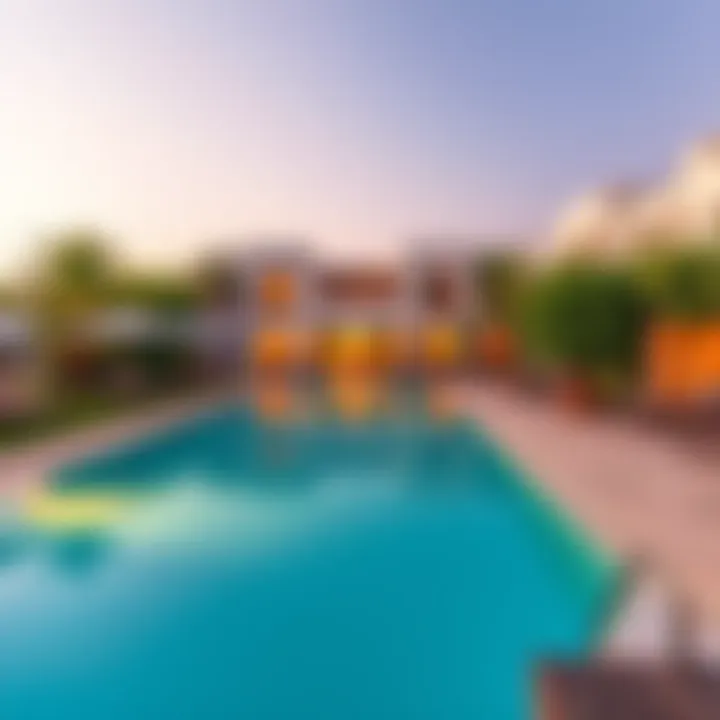 A beautiful resort featuring Santorini-style architecture and a stunning travertine pool surrounded by lush greenery and lounge chairs.