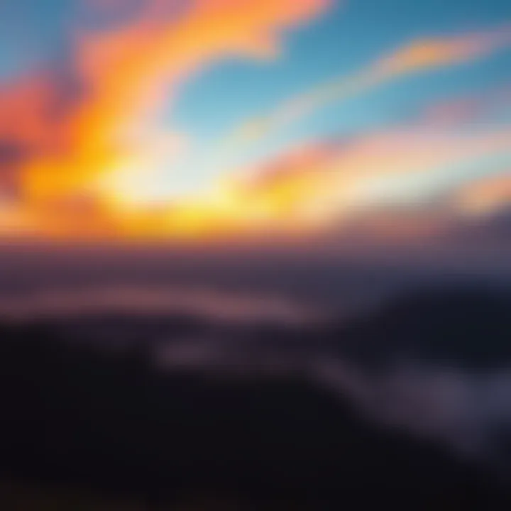A breathtaking view of a sunrise with vibrant colors spreading across the sky and illuminating the landscape below.