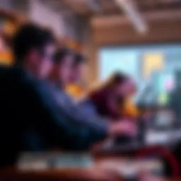 A group of teenagers collaborating on game design projects during a hands-on workshop
